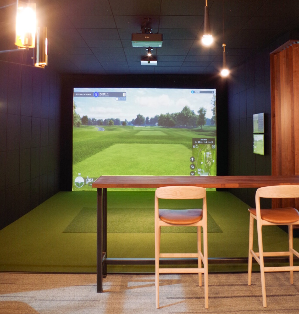 Simulator bay and seating at Mashies Golf Lounge