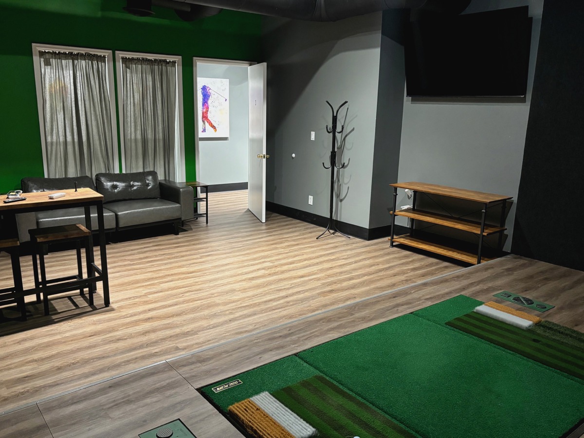 Simulator room and seating at Next Level Golf
