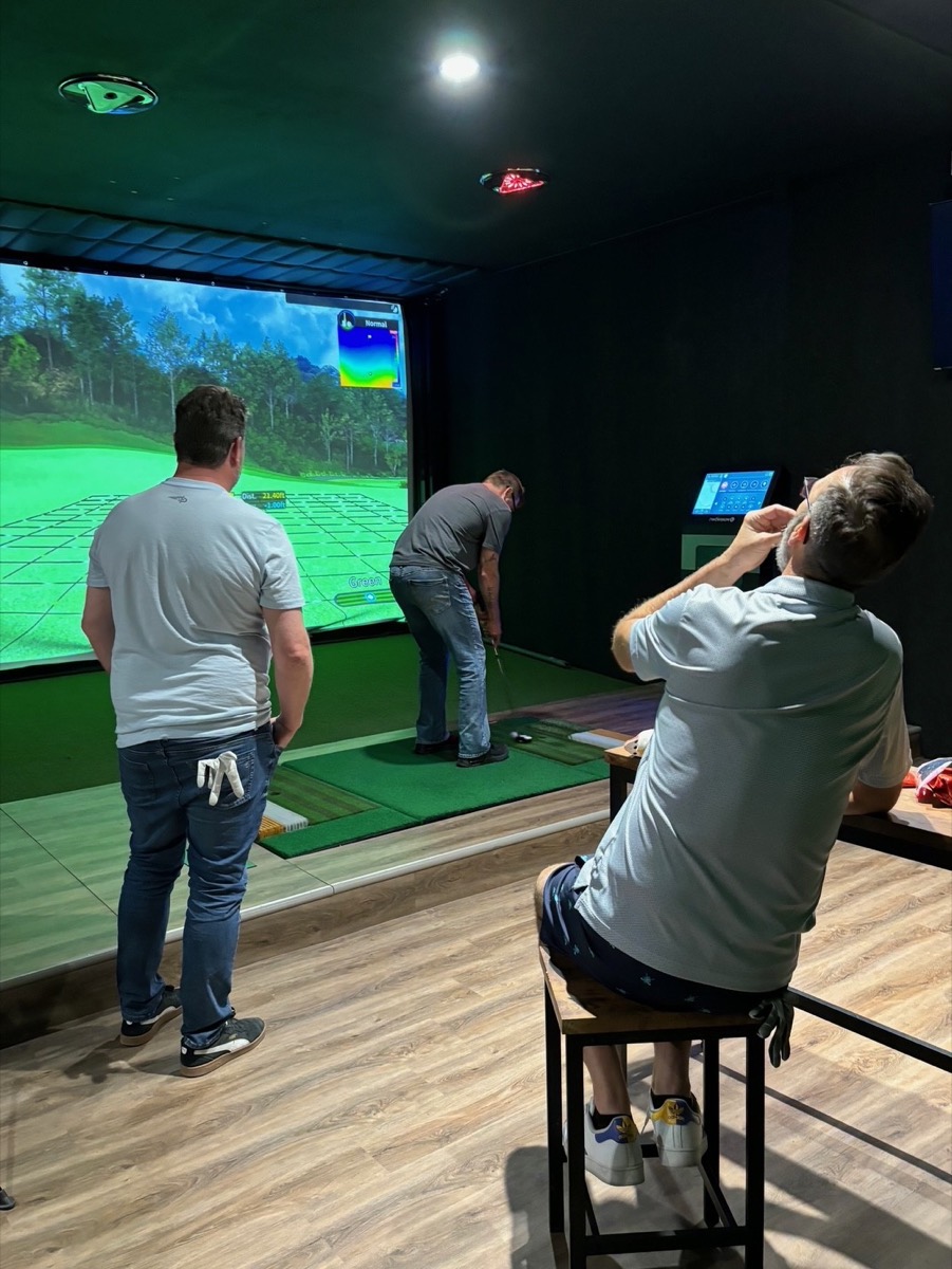 Golfers using the simulator at Next Level Golf